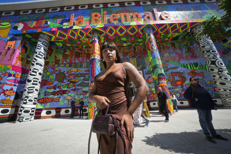 Brazilian artist Manauara Clandestina poses in front of the main pavilion at the Venice Biennale on April 16, 2024. 