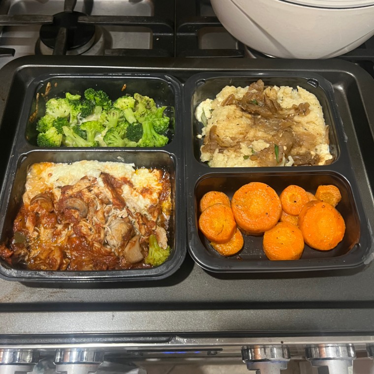 Two Factor meals side by side on a stovetop.