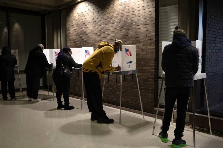 Voters cast ballots at a polling location in Southfield, Mich.