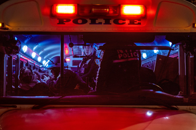 NYPD officers on a bus after detaining students and protesters who had set up an encampment on the campus of New York University to protest the Israel-Hamas war in New York on April 22, 2024. 