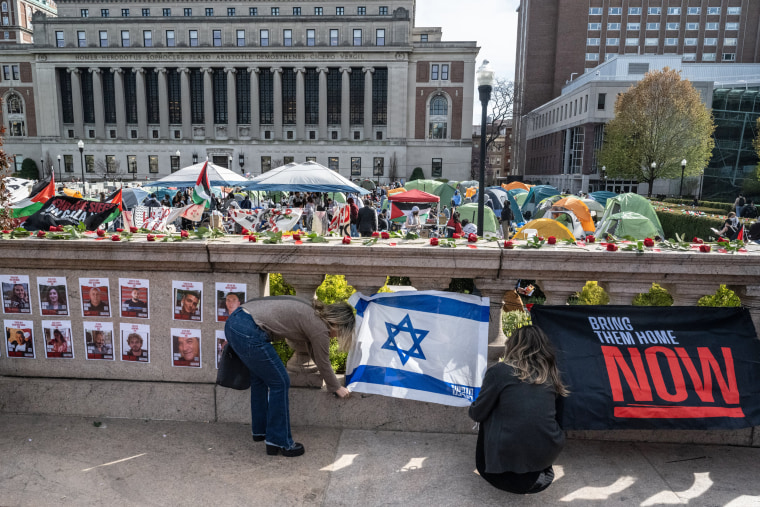 People set up a makeshift memorial for the Israeli hostages held by Hamas next to the "Gaza Solidarity Encampment" at Columbia University on April 23, 2024 in New York.