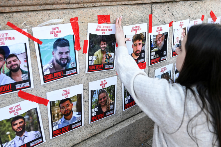 Posters of missing Israeli hostages are taped at Columbia University
