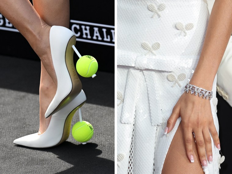 Zendaya tennis ball heels in Rome and tennis racket skirt in London.