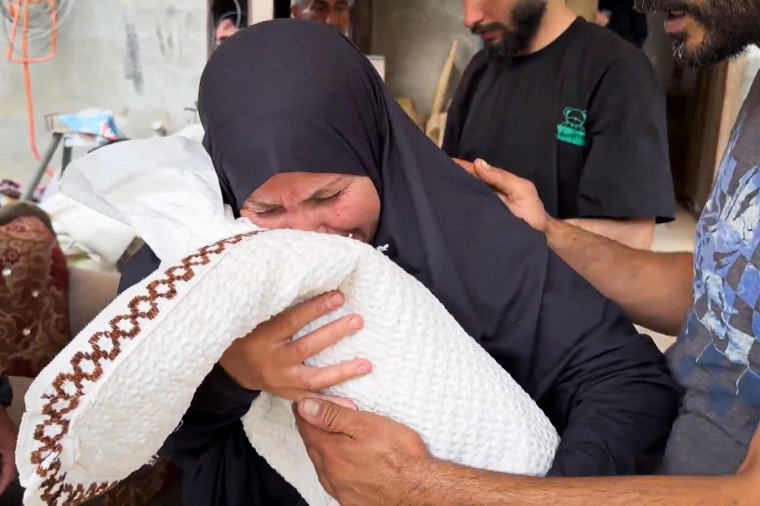 After saying their goodbyes, the family took Sabreen to a dusty, sand-filled cemetery in Rafah, where they dug down with shovels to the grave that her family was buried in a week ago.