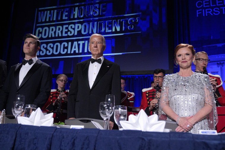 Host Colin Jost, left, President Joe Biden and Kelly O'Donnell
