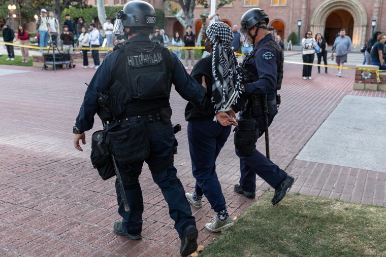 Members of the law enforcement and police officers intervene the Pro-Palestinian student protesters at University of Southern California 