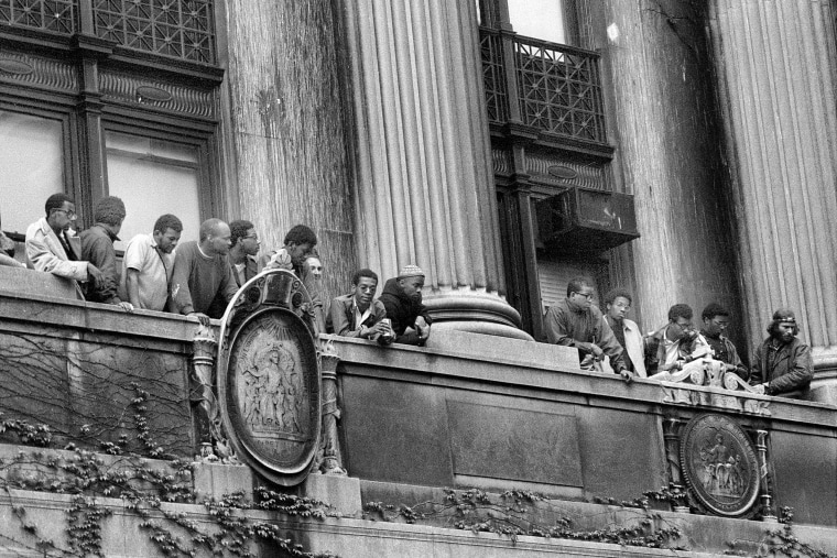 African American students look down on the balcony of Hamilton Hall 