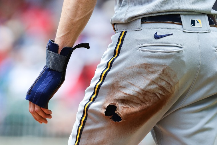 A torn hole in the pants of an MLB uniform