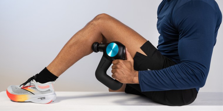 The Theragun massager helps relax and relieve muscles after an intense workout. 
