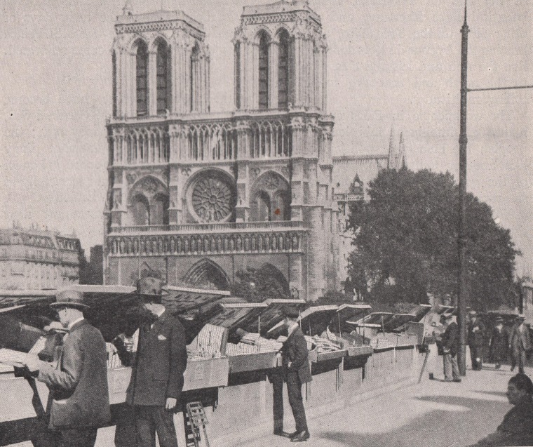 Shoppers peruse bookstalls beneath the towers of Notre Dame in Paris, 1923.