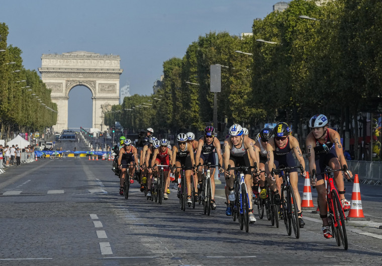 The first leg of the women's triathlon test event for the 2024 Olympics Games, on the Avenue des Champs-Élysées on Aug. 17, 2023. 