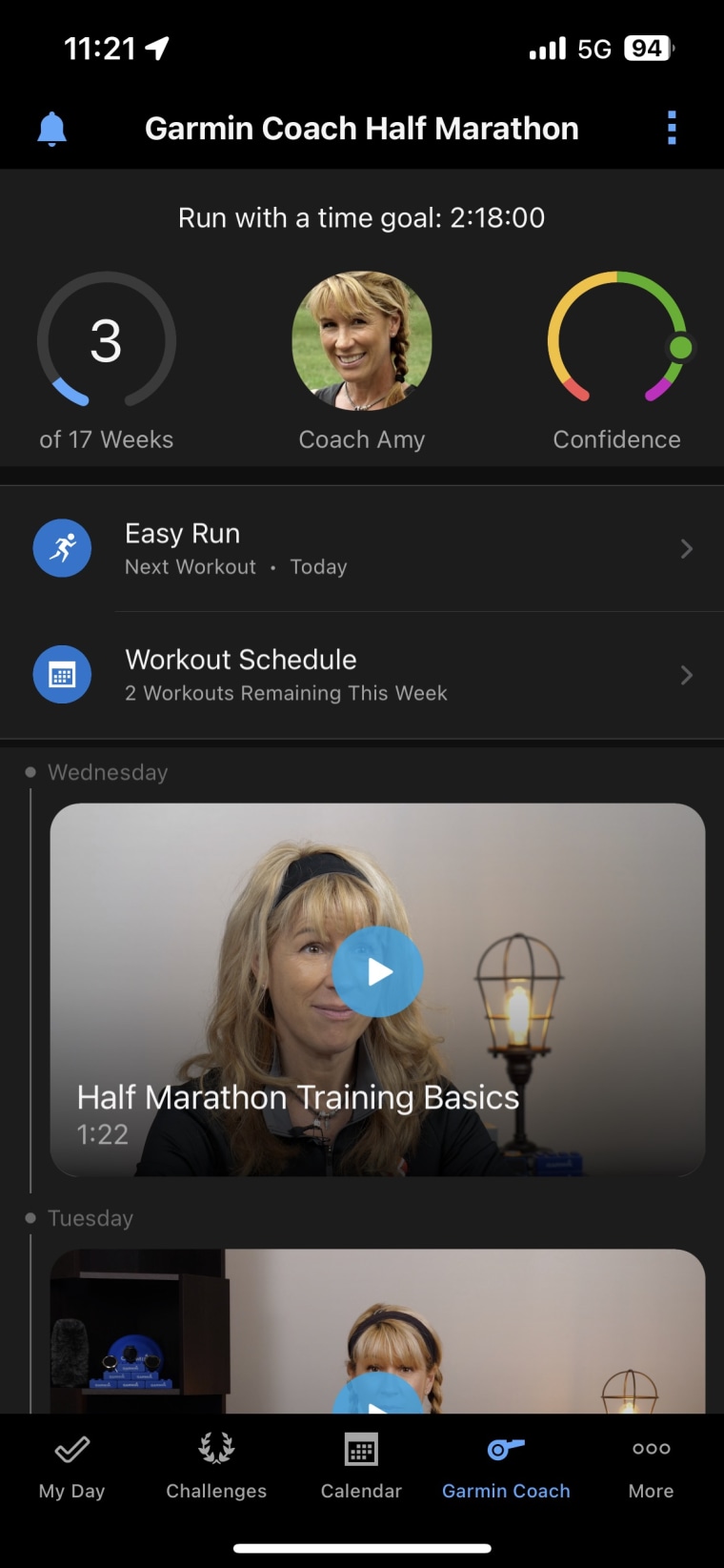 An image of the Garmin Coach screen within the Garmin Connect app, showing upcoming runs and training videos from the Garmin virtual coach.