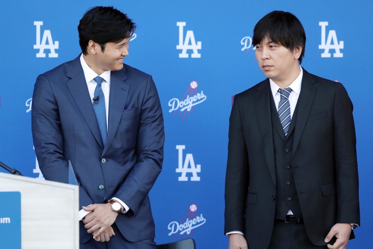 Shohei Ohtani with interpreter  Ippei Mizuhara at Dodgers introductory press conference.