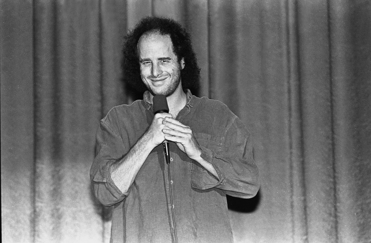 Comedian, actor and writer Steven Wright is shown performing on stage during a "live" concert appearance on October 1, 1998.