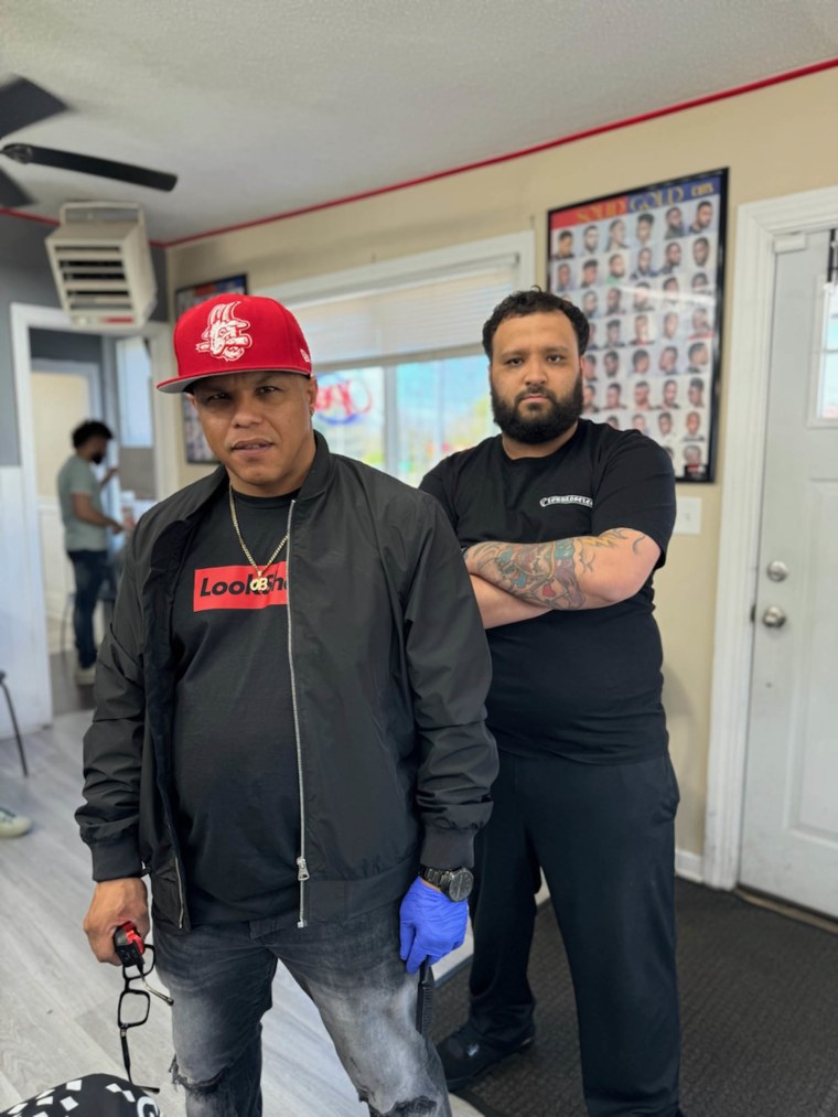 Barbershop owner Osvaldo Lugo, left, and barber Rafael Santana have been hailed as heroes.
