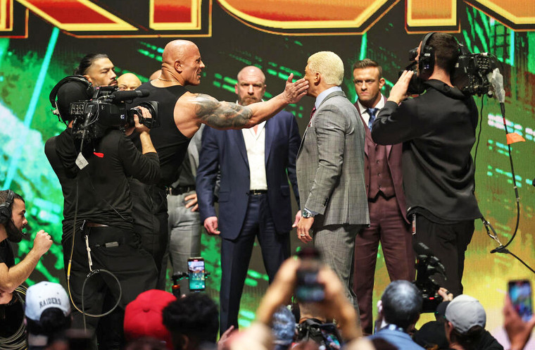 The Rock slaps Cody Rhodes at WrestleMania 40 kickoff event in Las Vegas.