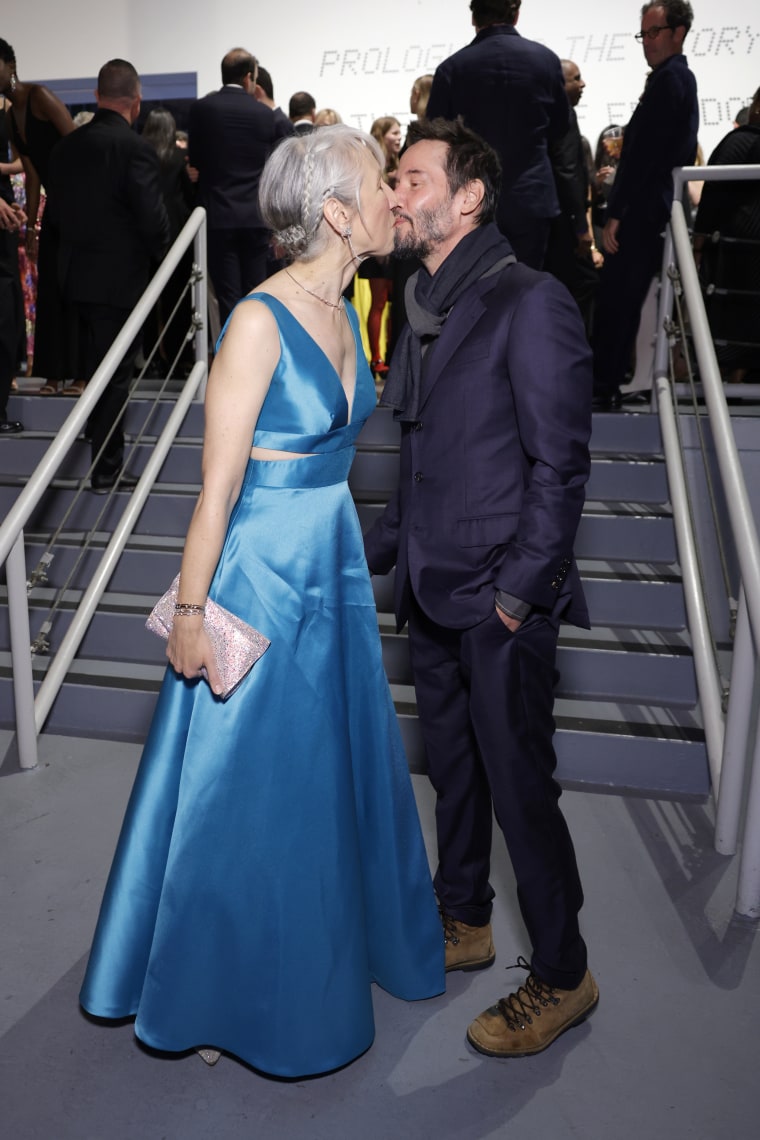 Alexandra Grant and Keanu Reeves share a kiss as they attend MOCA Gala 2024 at The Geffen Contemporary at MOCA on April 13, 2024 in Los Angeles.