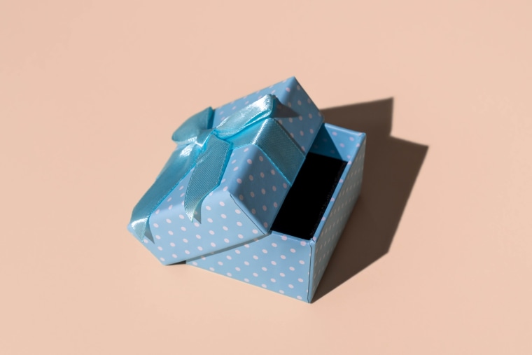 Open Blue Gift Box On Salmon Background