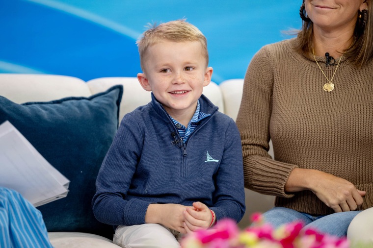 Oscar smiles on the set of TODAY as his parents share their harrowing story with Hoda and Savannah.