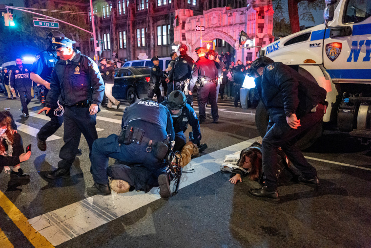 Police arrest protesters during pro-Palestinian demonstrations at The City College Of New York on April 30, 2024.