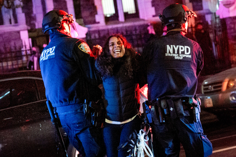 Police arrest protesters at The City College Of New York.