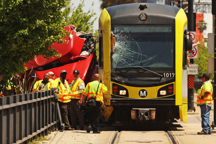 the aftermath of the collision between a Metro train and USC bus