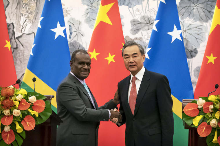 Jeremiah Manele, First Minister of the Solomon Islands, pictured with Chinese Foreign Minister Wang Yi in 2019.