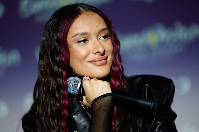 Eden Golan smiles during a press conference