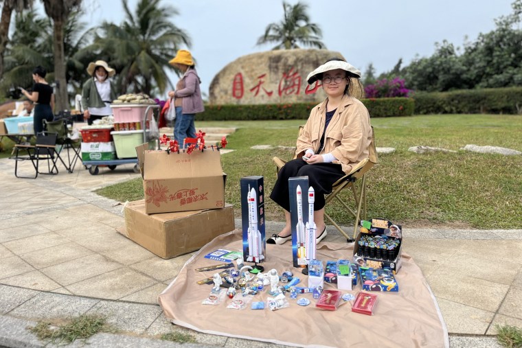 A street vendor selling space merchandise ahead of the lunar launch on Friday.
