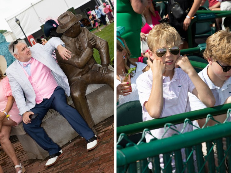A man in a flamboyant suit sits near a bronze statue of Matt Winn, a former manager and president of Churchill Downs; two boys in sunglasses in the stands.