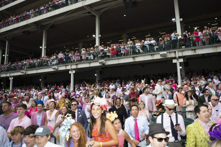 Hundreds of attendees in the grandstand.