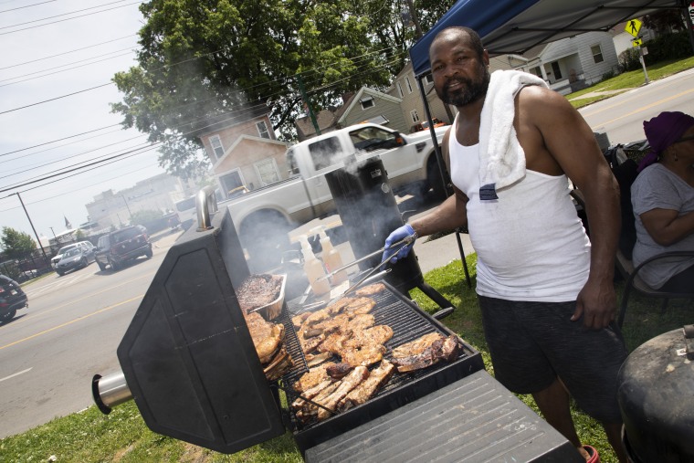 Derek Litzy grills pork chops, burgers and more on his lawn.