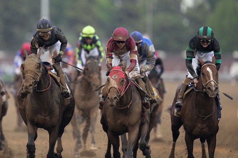 Mystik Dan and rider Brian Hernandez race to the line and win the 150th running of the Kentucky Derby horse race