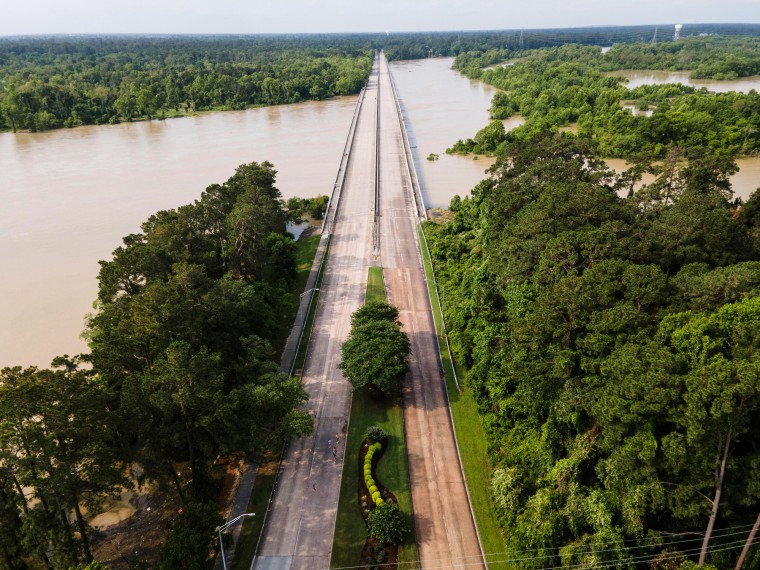 High waters rise on the bridge over Lake Houston along West Lake Houston Parkway
