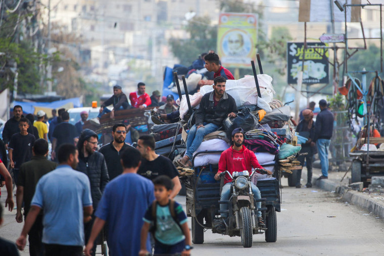 Displaced Palestinians flee Rafah with their belongings to safer areas in the southern Gaza Strip on May 7, 2024.