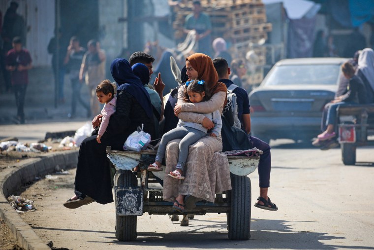 Displaced Palestinians travel on a cart in Rafah, southern Gaza Strip, on May 7, 2024.