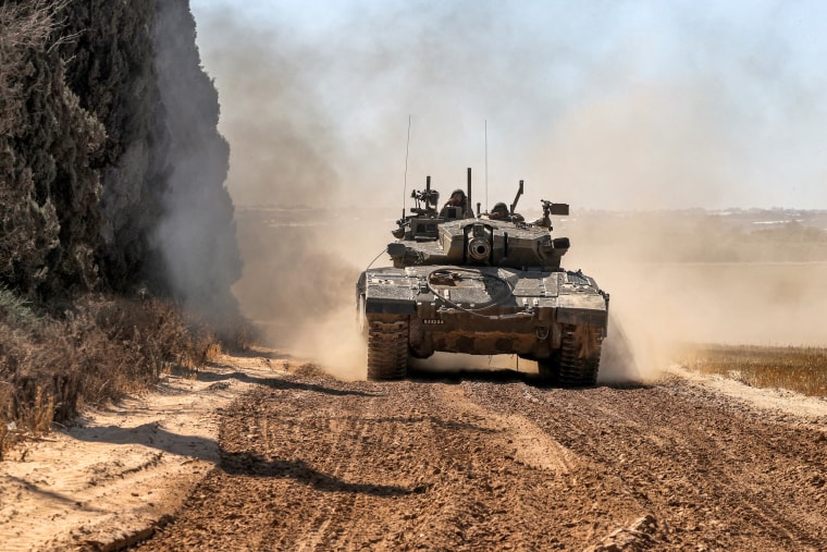 An Israeli army tanks moves along the border with the Gaza Strip in southern Israel on May 7, 2024.