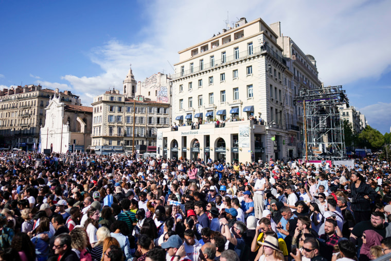 A large crowd gathers in the city of Marseille