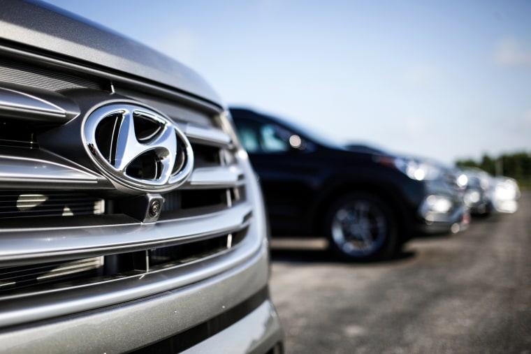 The Hyundai Motor Co. logo is seen on the front grill of a Santa Fe sports utility vehicle