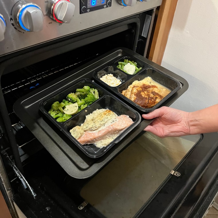 Factor meal tray placed into an oven