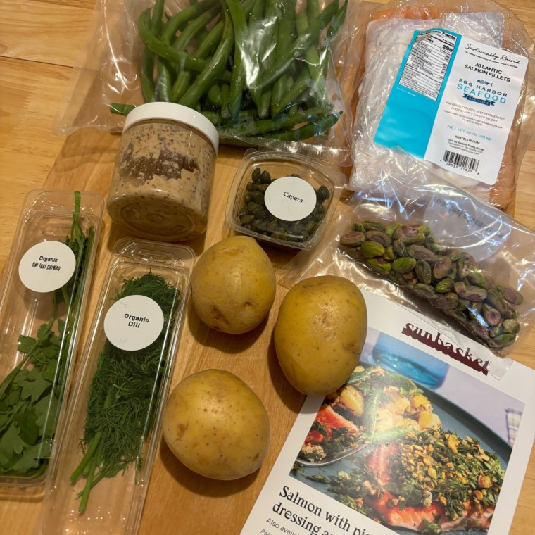 Packaged ingredients laid out on a cutting board