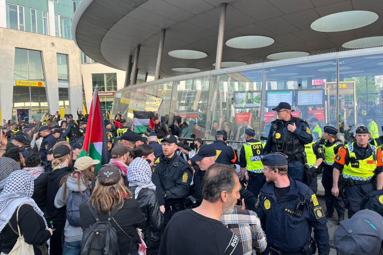 Groups of protesters gather outside the Malmö Arena.