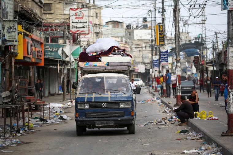 Palestinians transport their belongings on the back of a van as they flee Rafah on Saturday.