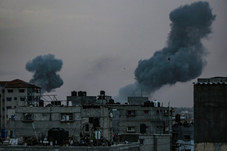 Smoke rises above buildings during an early morning Israeli strike on Rafah Saturday. 