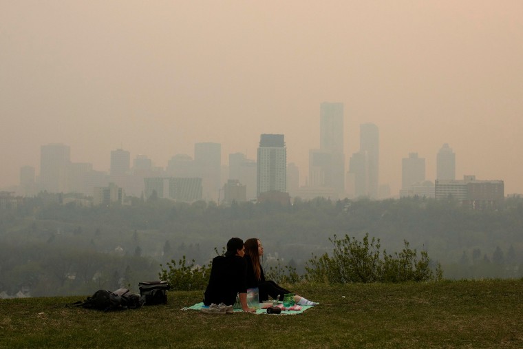 A couple has a picnic in Edmonton, Alberta
