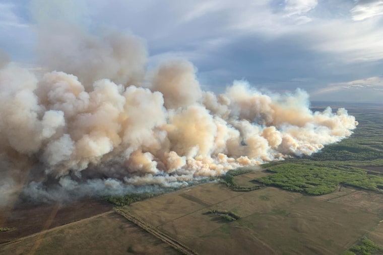 An aerial of smoke billowing 