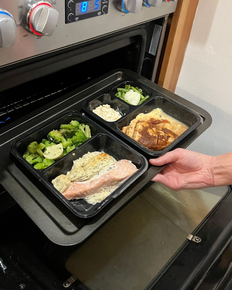 Factor meal being placed in the oven