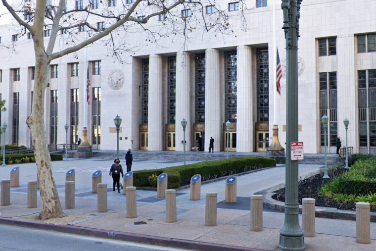 Pedestrians walk outside the U.S. Court House where the U.S. Attorney’s Office for the Central District of Calif., is located. 