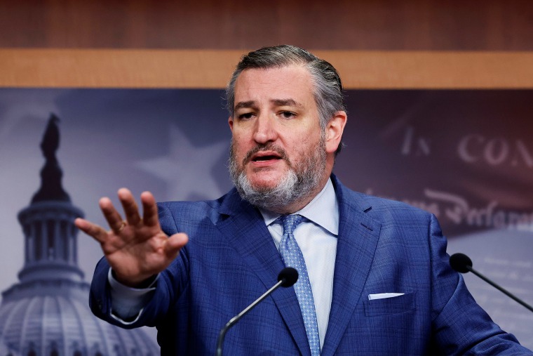 Ted Cruz gestures while speaking during a news conference