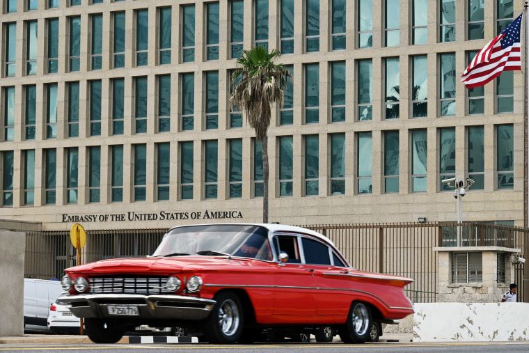 A car drives past the U.S.  embassy in Havana